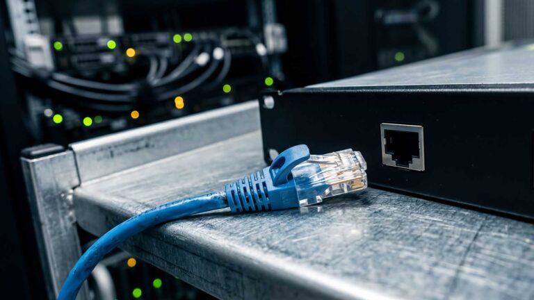 An ethernet cable unplugged from a networking device.